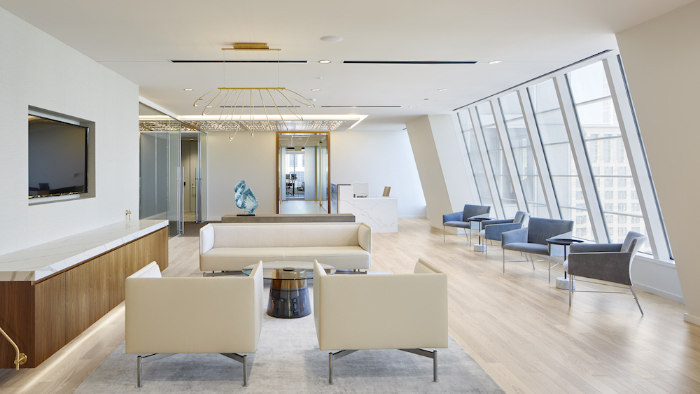 Modern lobby in a law office in Chicago, showcasing clean lines, expansive glass design, and engineered hardwood flooring.